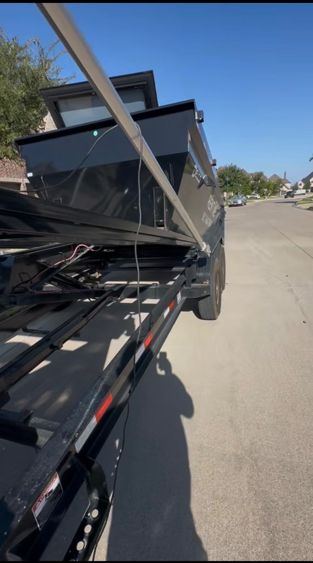 16-yard roll-off dumpster placed on a residential driveway in North Texas