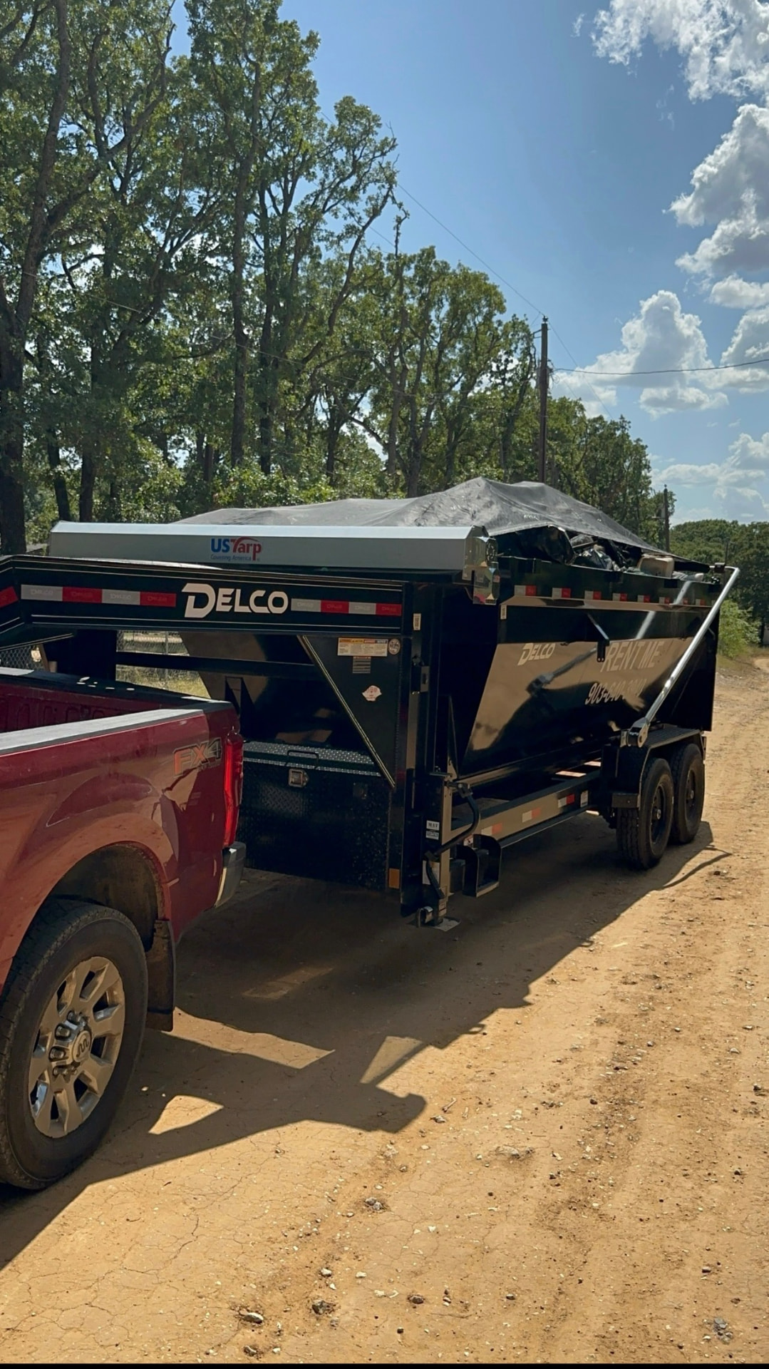 Tarped 16-yard dumpster loaded with construction debris in Colony, TX by HomeHaven Dumpsters