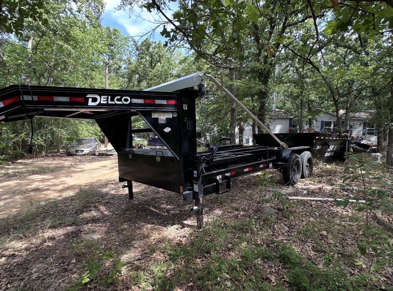 16-yard roll-off dumpster trailer delivered to a home in Wills Point, TX by HomeHaven Dumpsters